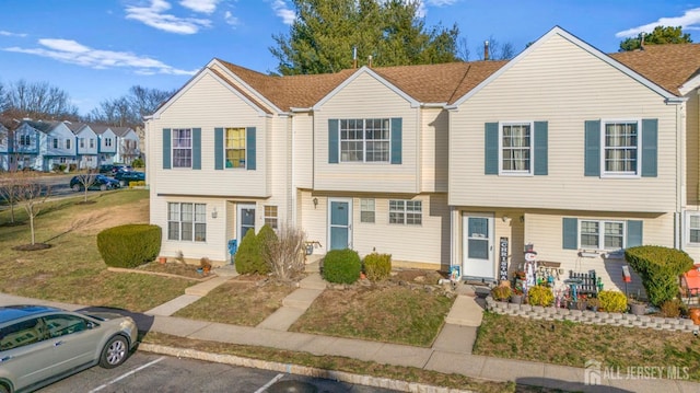 view of property featuring a front yard