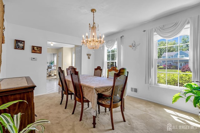 21 Van Hise Ct, East Brunswick, NJ 08816 - dining area featuring light carpet and a chandelier