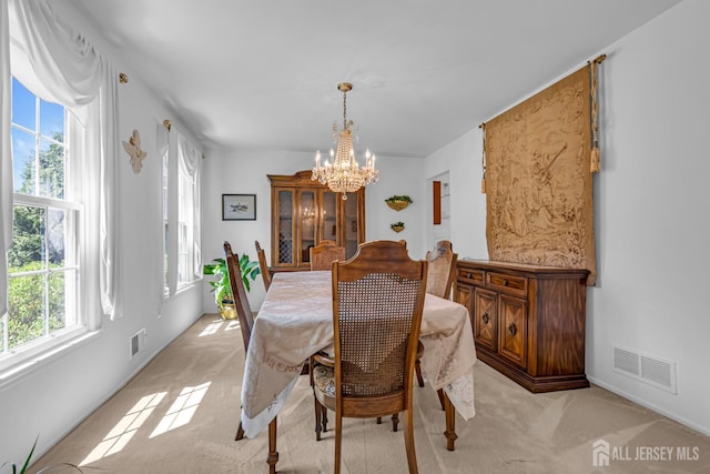 21 Van Hise Ct, East Brunswick, NJ 08816 - dining room featuring a chandelier and light carpet