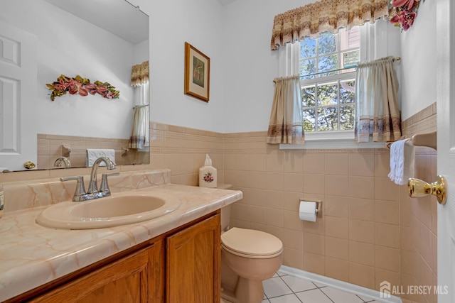 21 Van Hise Ct, East Brunswick, NJ 08816 - bathroom featuring tile patterned flooring, vanity, tile walls, and wainscoting