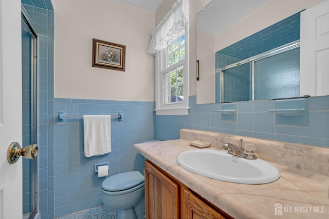 21 Van Hise Ct, East Brunswick, NJ 08816 - full bathroom with tile walls, vanity, a stall shower, and a wainscoted wall
