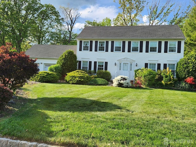 21 Van Hise Ct, East Brunswick, NJ 08816 - colonial-style house featuring a front yard and an attached garage
