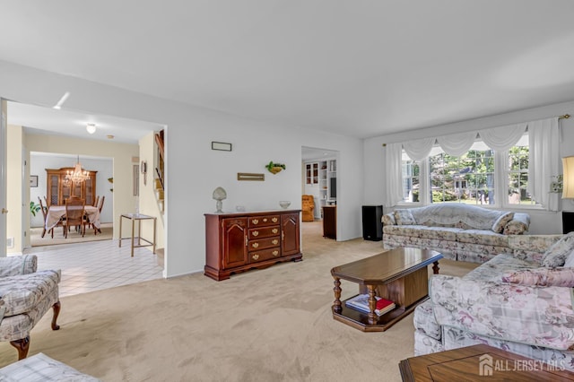 21 Van Hise Ct, East Brunswick, NJ 08816 - tiled living room with carpet flooring and a chandelier