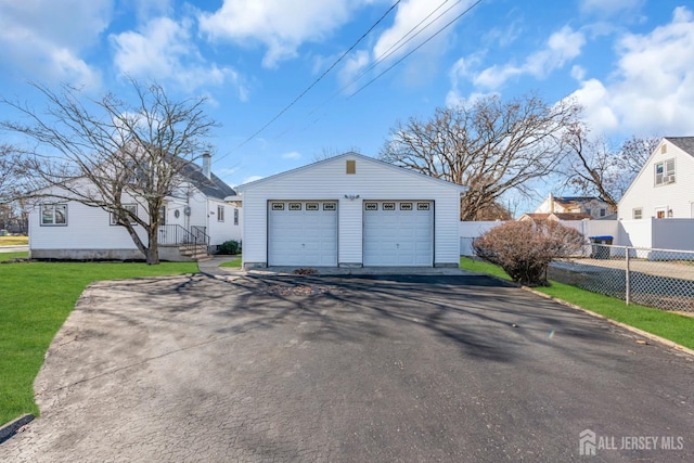 detached garage with fence