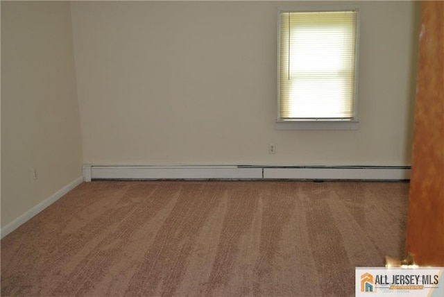 carpeted empty room featuring baseboards and baseboard heating
