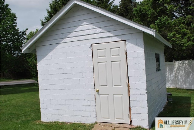 view of shed with fence