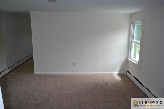 carpeted empty room featuring plenty of natural light, baseboards, and a baseboard radiator