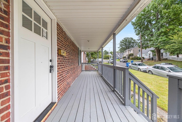 wooden terrace with a porch