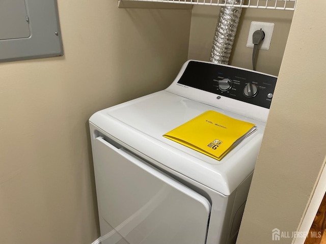 clothes washing area featuring washer / dryer and electric panel