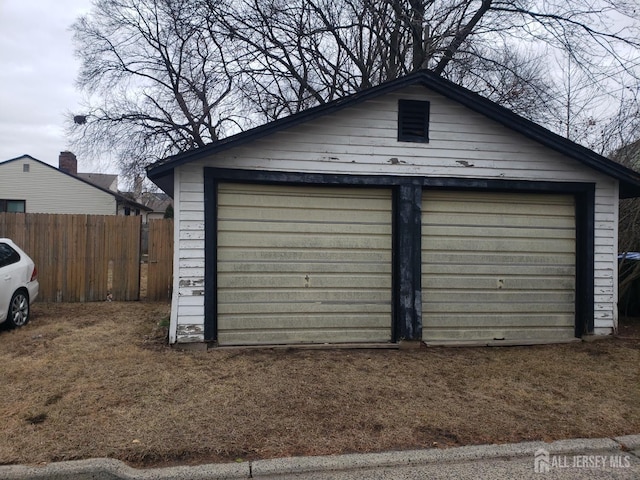 detached garage with fence