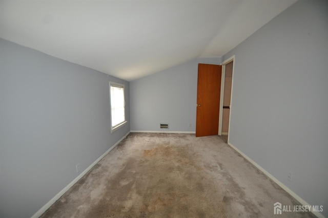 19 Clark Pl, Avenel, NJ 07001 - empty room with vaulted ceiling and light colored carpet