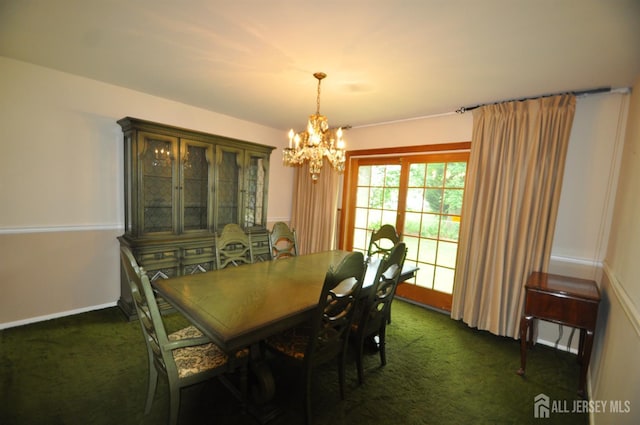 19 Clark Pl, Avenel, NJ 07001 - dining room featuring a chandelier and dark colored carpet