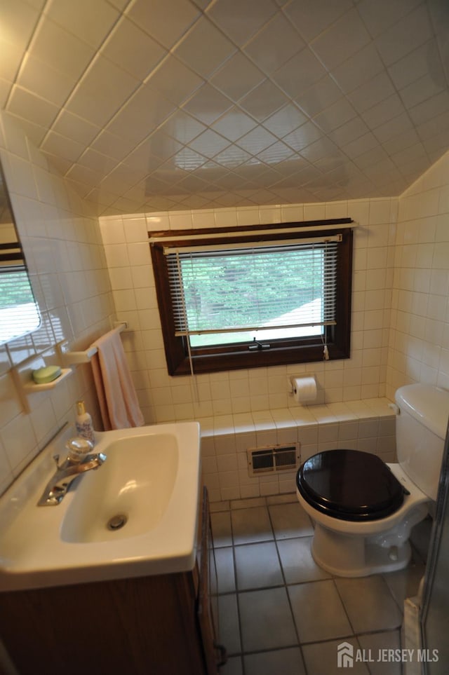 19 Clark Pl, Avenel, NJ 07001 - half bathroom with tile walls, tile patterned floors, and vanity