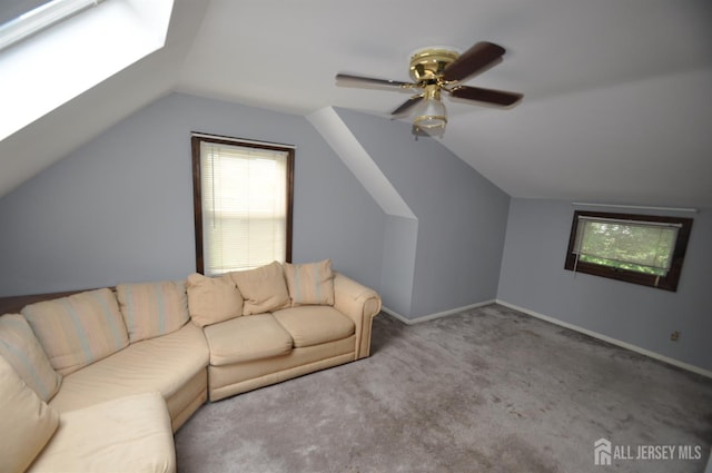 19 Clark Pl, Avenel, NJ 07001 - carpeted living room with vaulted ceiling, ceiling fan, plenty of natural light, and a skylight