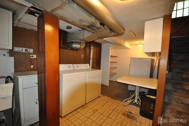 19 Clark Pl, Avenel, NJ 07001 - below grade area featuring washer and clothes dryer and brick patterned floors