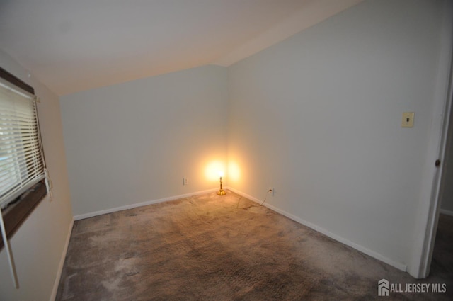 19 Clark Pl, Avenel, NJ 07001 - carpeted empty room with baseboards and lofted ceiling