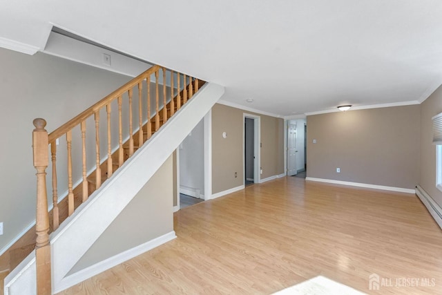 unfurnished living room with hardwood / wood-style floors, a baseboard radiator, and ornamental molding