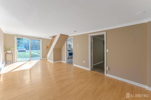 additional living space with light hardwood / wood-style flooring