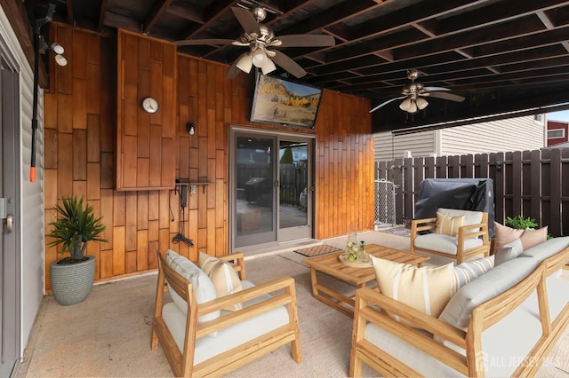 view of patio with ceiling fan, outdoor lounge area, and fence