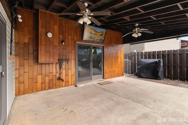view of patio / terrace with a ceiling fan and fence