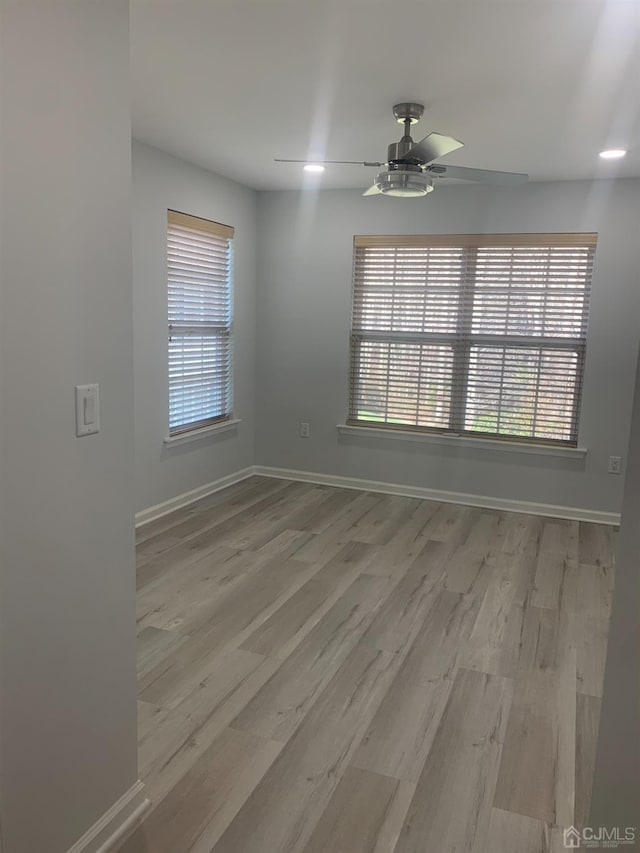 1156 Morning Glory Dr, Monroe, NJ 08831 - empty room featuring light wood-style floors, a ceiling fan, and baseboards