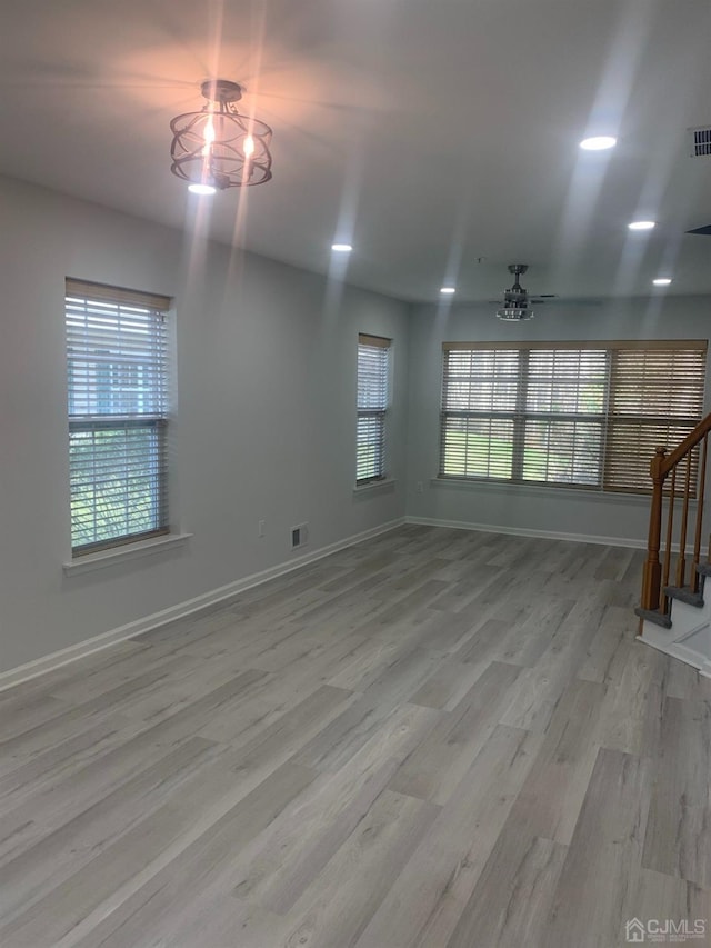 1156 Morning Glory Dr, Monroe, NJ 08831 - unfurnished living room featuring stairway, wood finished floors, baseboards, and a ceiling fan