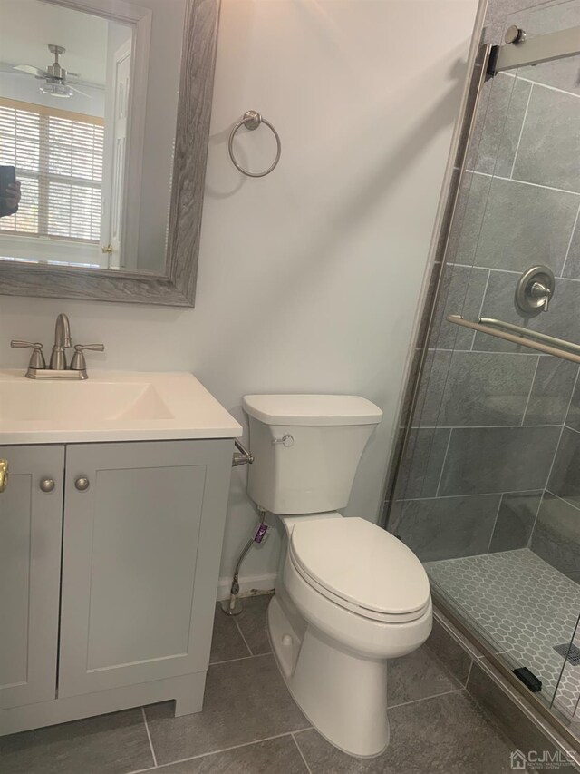 1156 Morning Glory Dr, Monroe, NJ 08831 - full bath featuring tile patterned floors, vanity, toilet, a stall shower, and ceiling fan
