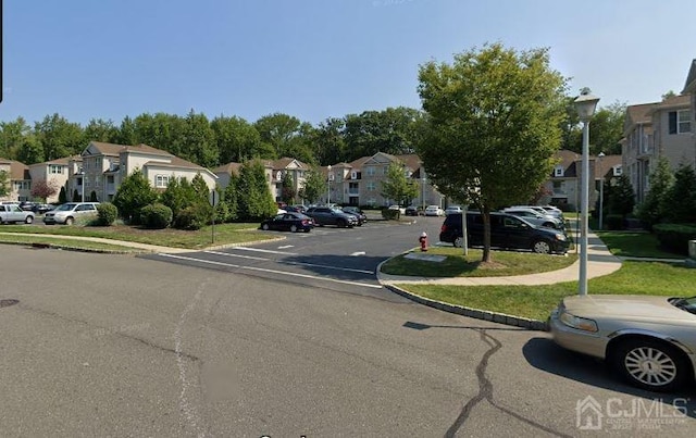 1156 Morning Glory Dr, Monroe, NJ 08831 - view of asphalt road featuring a residential view, street lighting, sidewalks, and curbs
