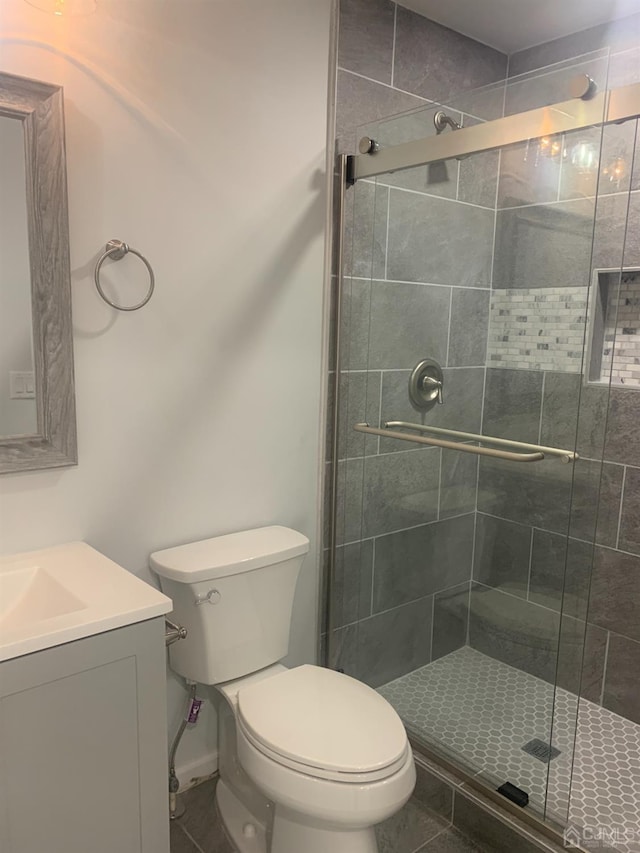 1156 Morning Glory Dr, Monroe, NJ 08831 - bathroom featuring vanity, a stall shower, toilet, and tile patterned flooring