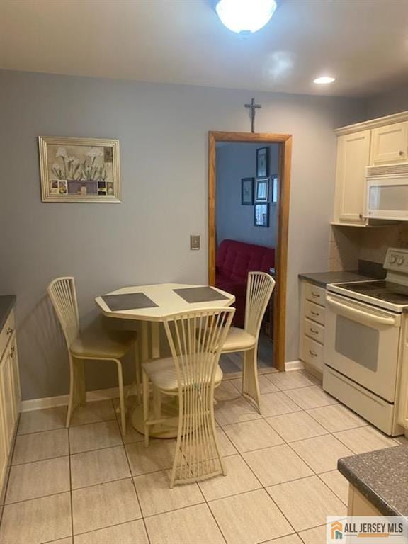 100 Neilly Ct Unit 100, Old Bridge, NJ 08857 - dining space featuring light tile patterned floors, baseboards, and recessed lighting