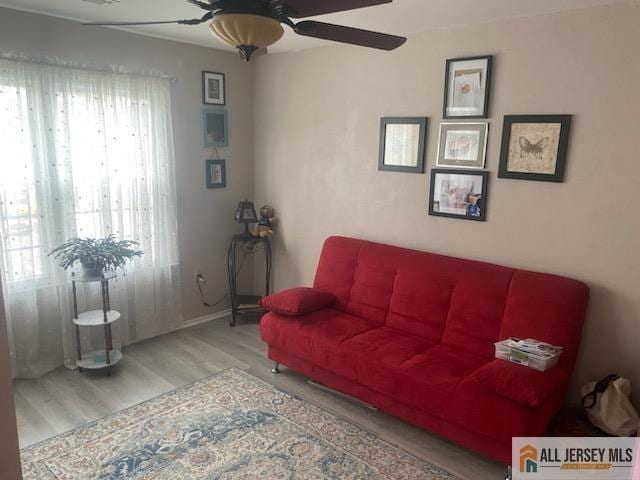 100 Neilly Ct Unit 100, Old Bridge, NJ 08857 - living area featuring wood finished floors, a ceiling fan, and baseboards
