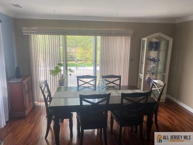100 Neilly Ct Unit 100, Old Bridge, NJ 08857 - dining area with wood finished floors, baseboards, and ornamental molding