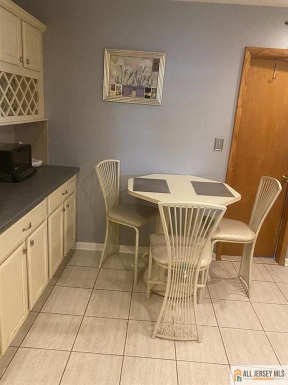 100 Neilly Ct Unit 100, Old Bridge, NJ 08857 - dining area featuring light tile patterned floors and baseboards