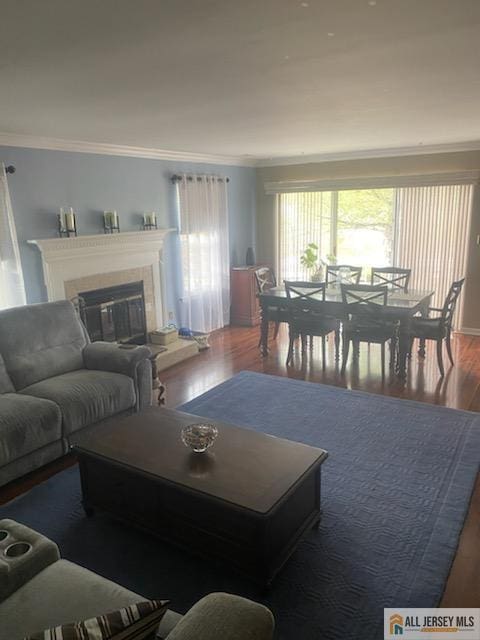 100 Neilly Ct Unit 100, Old Bridge, NJ 08857 - living room with crown molding, wood finished floors, and a tiled fireplace