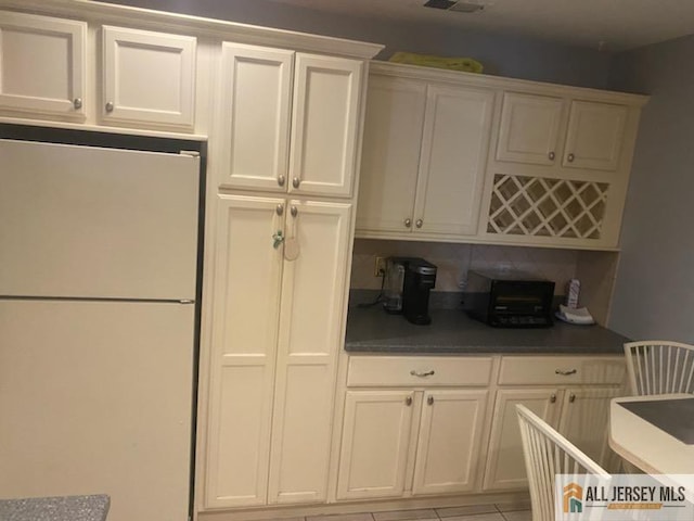 100 Neilly Ct Unit 100, Old Bridge, NJ 08857 - kitchen featuring freestanding refrigerator and white cabinets