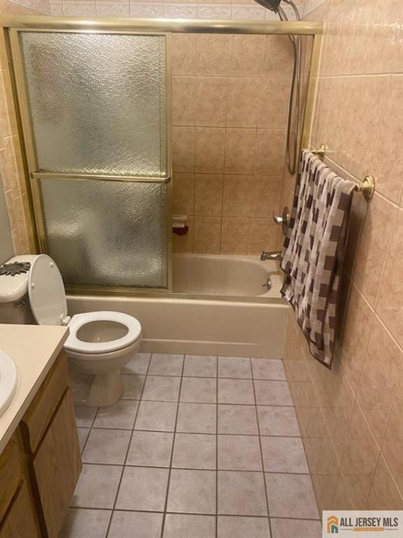 100 Neilly Ct Unit 100, Old Bridge, NJ 08857 - full bathroom featuring tile patterned flooring, combined bath / shower with glass door, vanity, and toilet