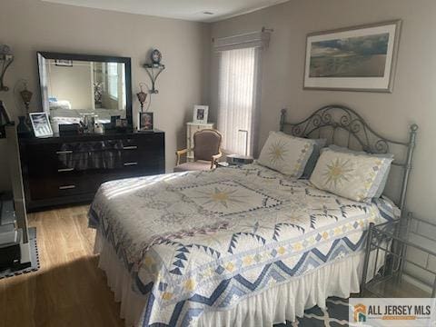 100 Neilly Ct Unit 100, Old Bridge, NJ 08857 - bedroom with wood finished floors