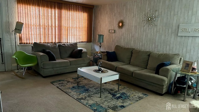 living room with wooden walls and carpet floors