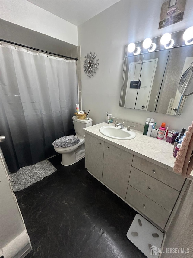 full bathroom featuring toilet and vanity