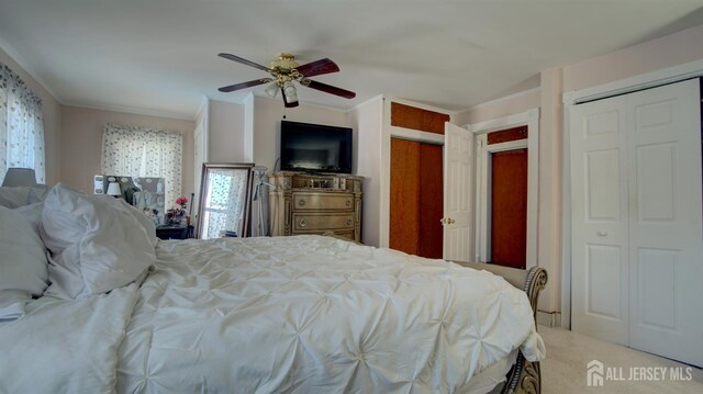 110 N Pine Ave, South Amboy, NJ 08879 - carpeted bedroom with crown molding, two closets, and ceiling fan
