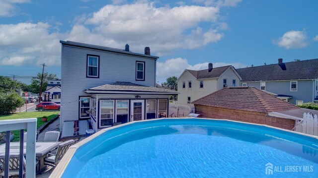 110 N Pine Ave, South Amboy, NJ 08879 - swimming pool featuring a sunroom and a fenced backyard