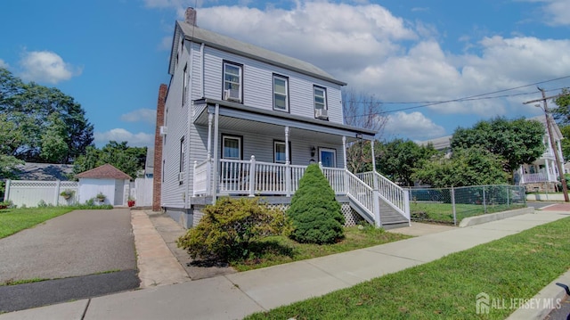110 N Pine Ave, South Amboy, NJ 08879 - view of front facade with a porch and a chimney