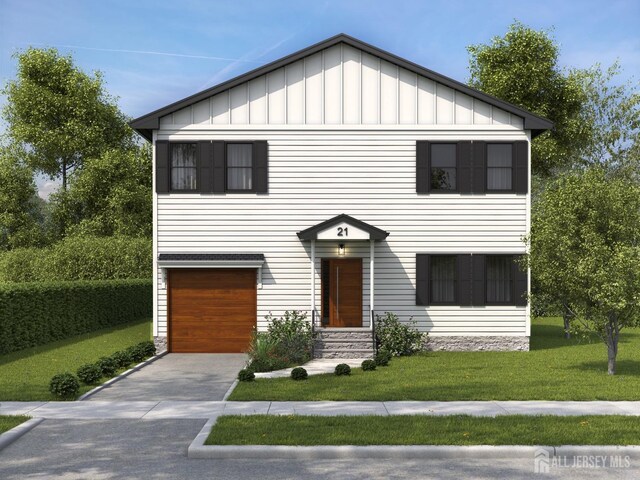 view of front of house with a front lawn and a garage