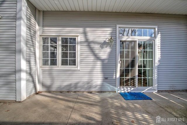 doorway to property featuring a patio area