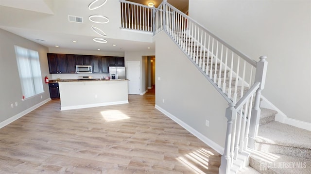 kitchen with visible vents, light wood-style flooring, recessed lighting, appliances with stainless steel finishes, and baseboards