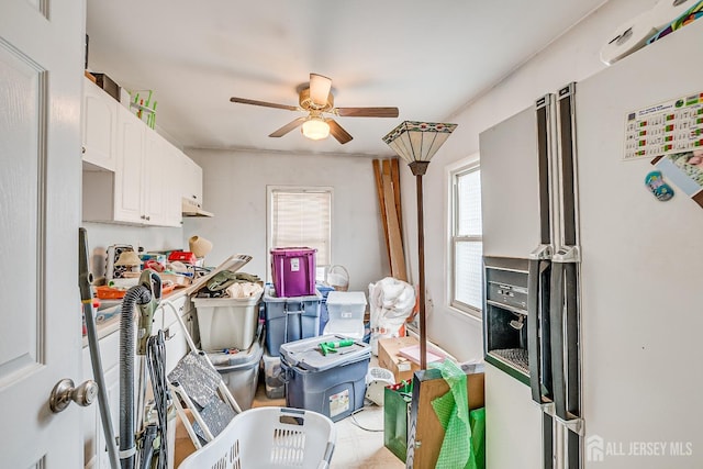 127 Hill St, Highland Park, NJ 08904 - kitchen featuring white fridge with ice dispenser, ceiling fan, and white cabinets