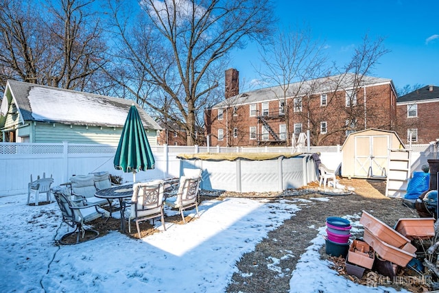 127 Hill St, Highland Park, NJ 08904 - yard layered in snow featuring a shed and a fenced backyard
