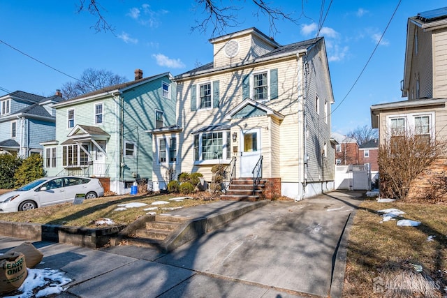 127 Hill St, Highland Park, NJ 08904 - view of front of property featuring a gate, concrete driveway, and a residential view