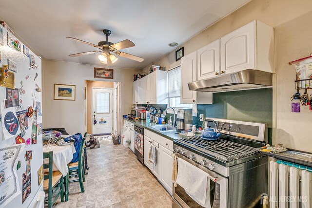 127 Hill St, Highland Park, NJ 08904 - kitchen with stainless steel range with gas stovetop, freestanding refrigerator, under cabinet range hood, white cabinets, and ceiling fan