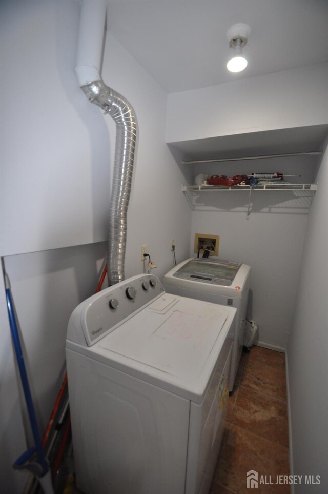 washroom with washer and dryer